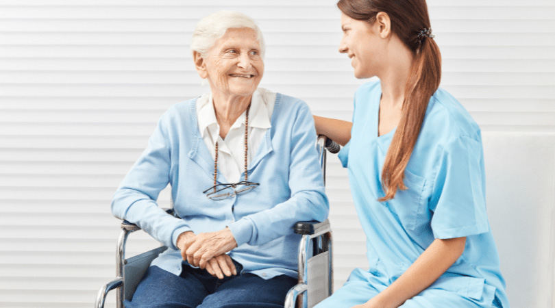 A woman and her nurse engaging in conversation